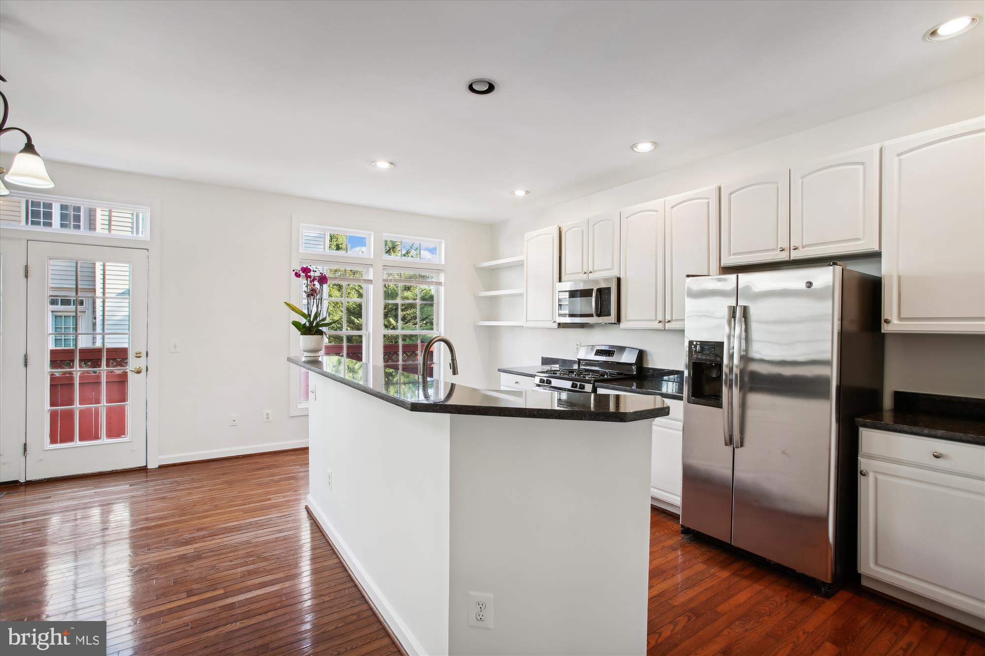 5803 Summers Grove Road Alexandria, VA 22304 - Photo 9 of 43 a kitchen with stainless steel appliances a refrigerator sink and microwave