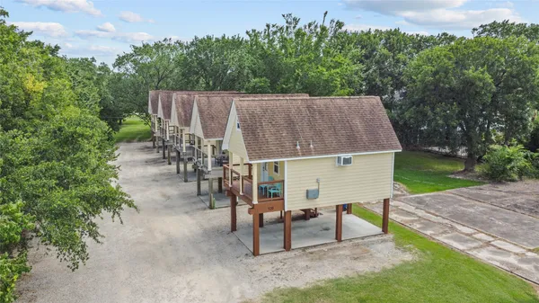 an aerial view of a house having yard patio and sitting area