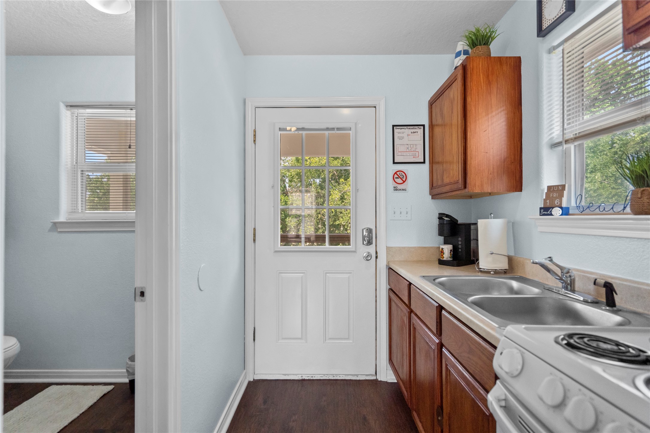 120 Grove Road, Unit 4 Kemah, TX 77565 - Photo 12 of 20 a kitchen that has a sink a stove and a window