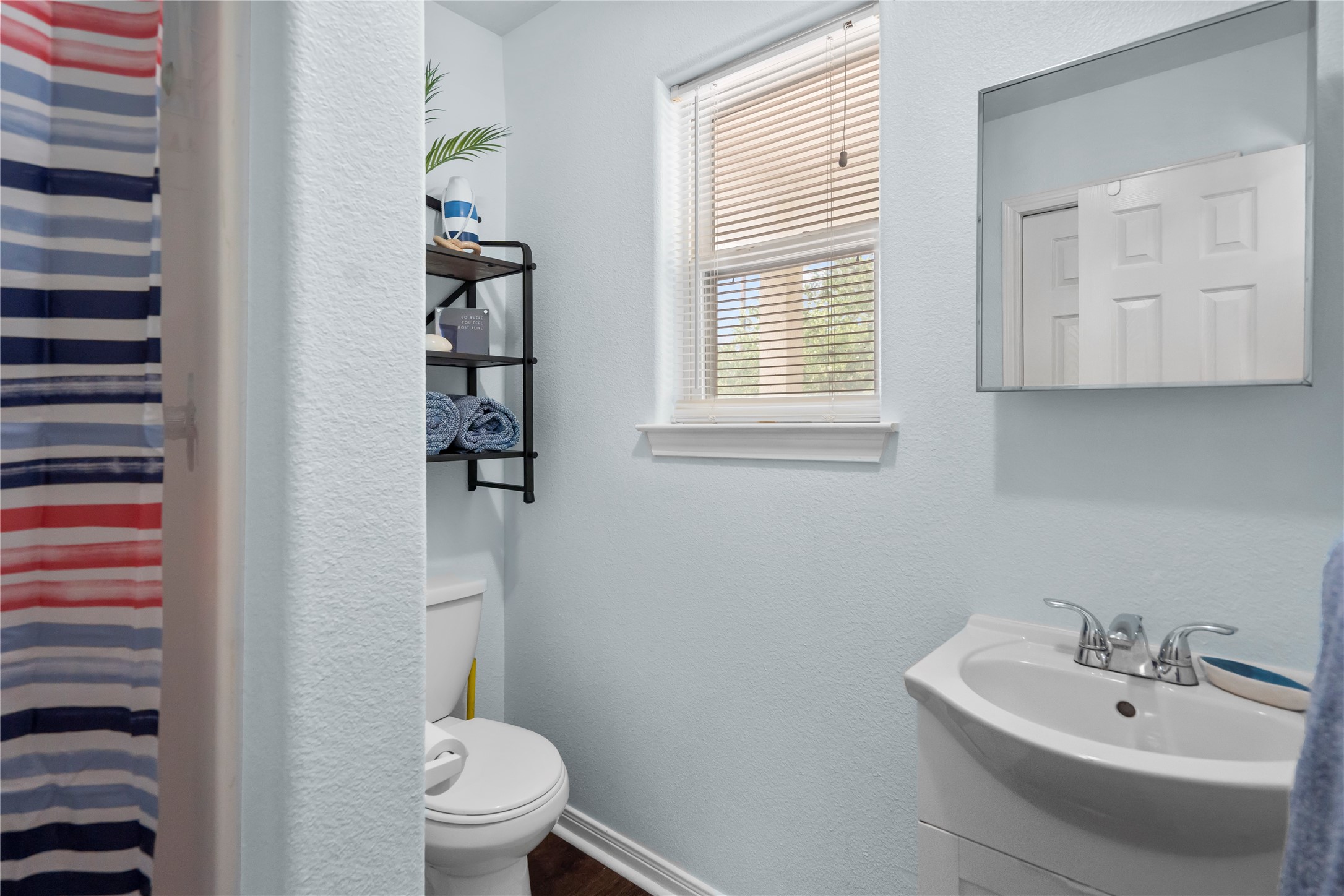 120 Grove Road, Unit 4 Kemah, TX 77565 - Photo 13 of 20 a bathroom with a sink a toilet and shower