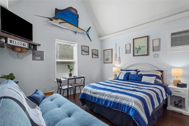 a bedroom with bed and a window