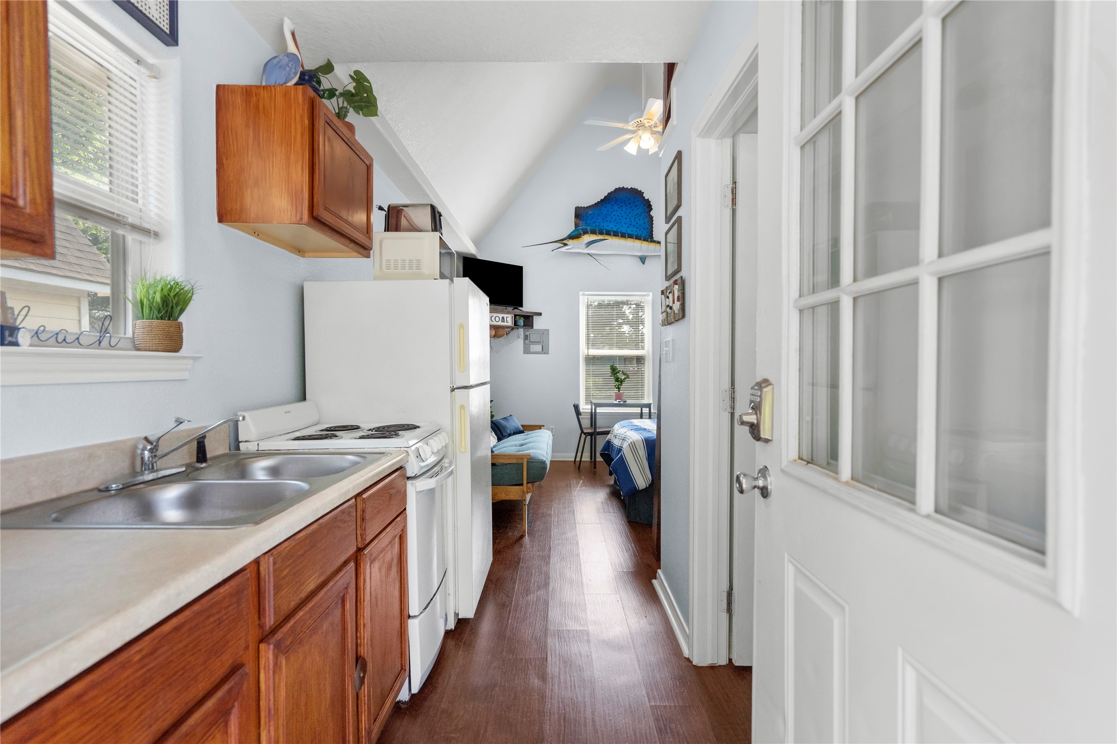 120 Grove Road, Unit 4 Kemah, TX 77565 - Photo 10 of 20 a kitchen with a sink and a refrigerator