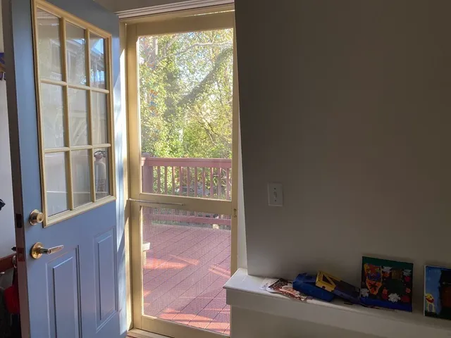 a view of an empty room with a window