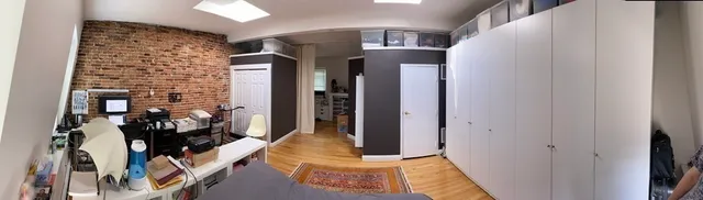 a view of an entryway with wooden floor