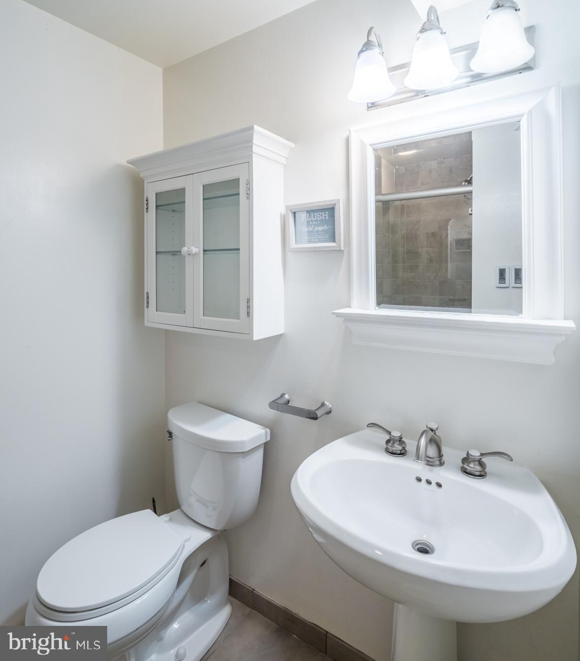 3424 O Street Northwest Washington, DC 20007 - Photo 14 of 29 a bathroom with a toilet a sink and mirror