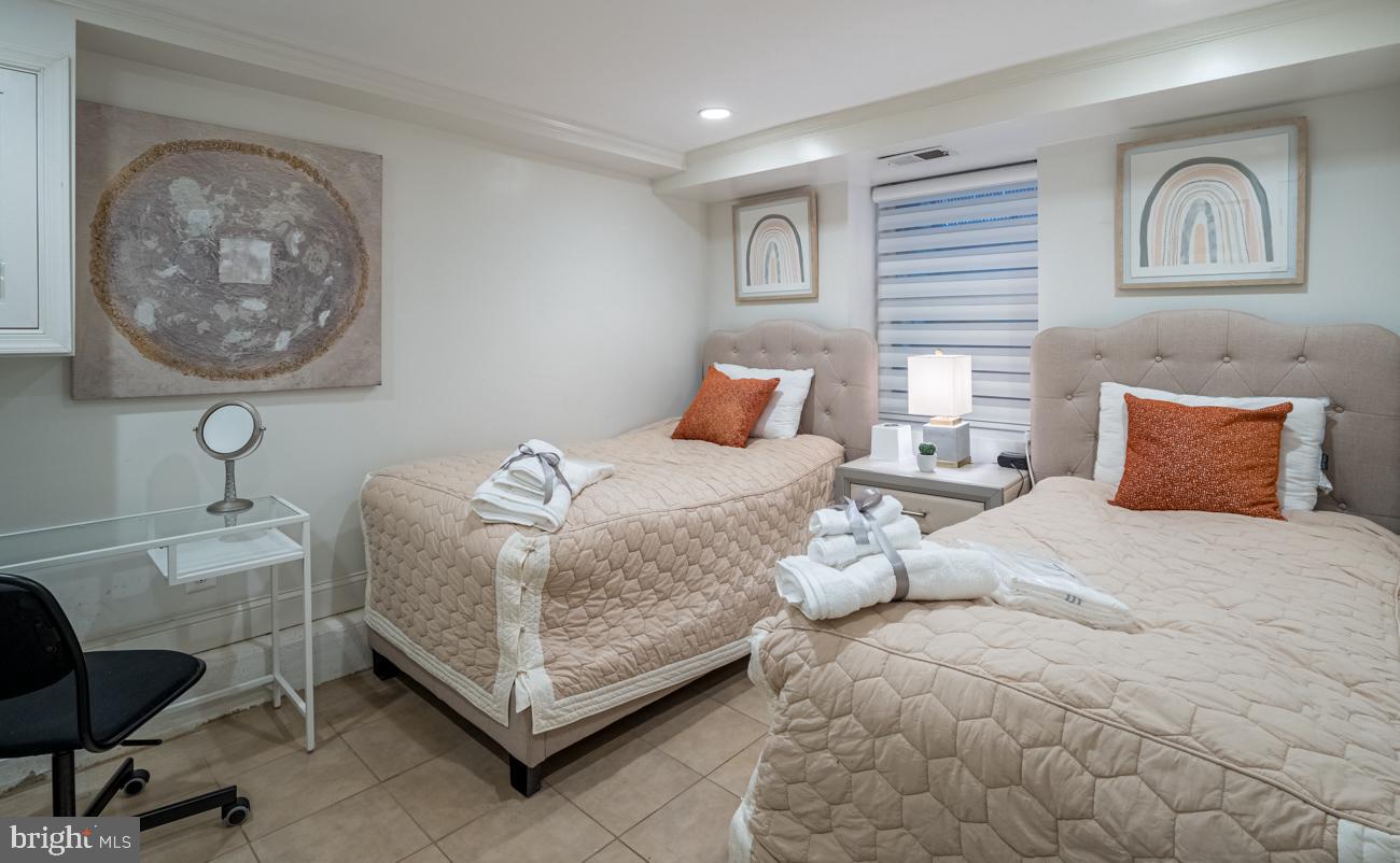 3424 O Street Northwest Washington, DC 20007 - Photo 15 of 29 a bedroom with a bed and a couch