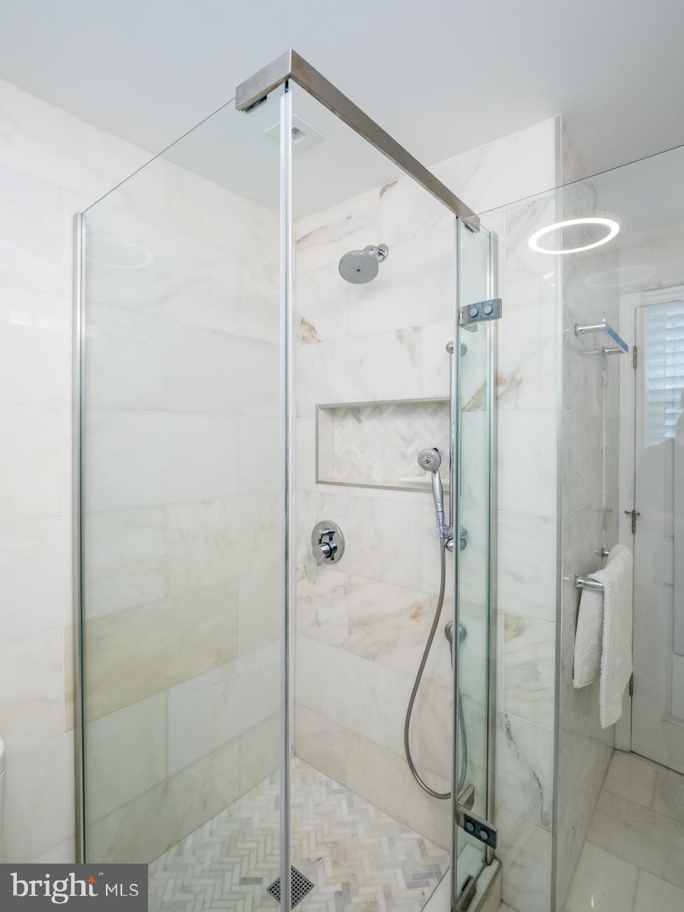 3424 O Street Northwest Washington, DC 20007 - Photo 17 of 29 a bathroom with a glass shower door