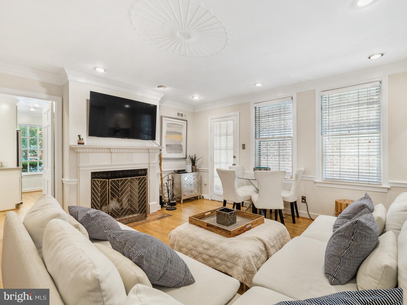 3424 O Street Northwest Washington, DC 20007 - Photo 4 of 29 a living room with furniture fireplace and flat screen tv