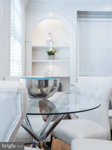 a living room with table and chair