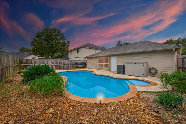 a front view of a house with a garden and plants