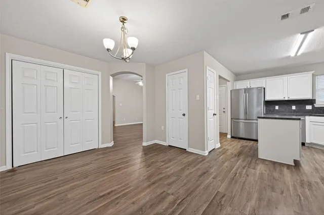 a view of an empty room with a bathroom