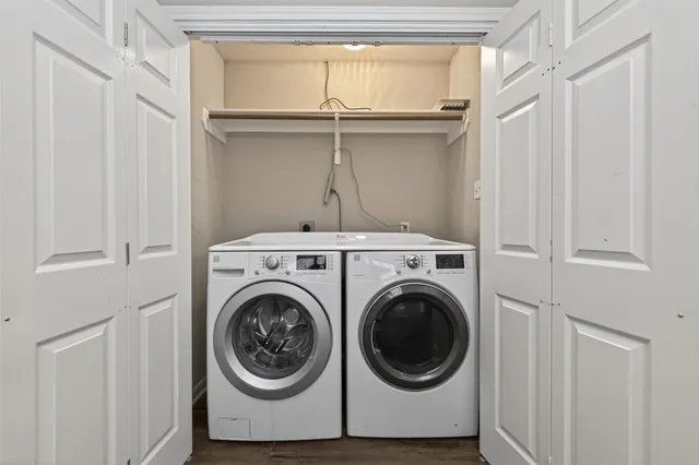 a view of a house with pool fire pit and wooden fence