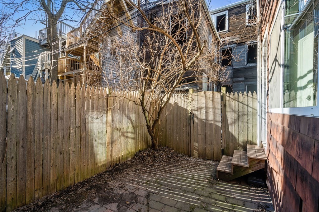 110 Elm Street, Unit 1 Boston, MA 02129 - Photo 15 of 17 a view of a backyard with sitting area