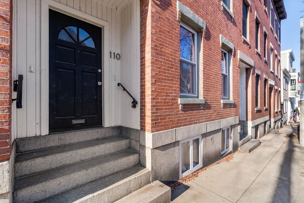 110 Elm Street, Unit 1 Boston, MA 02129 - Photo 17 of 17 a view of a brick building with many windows