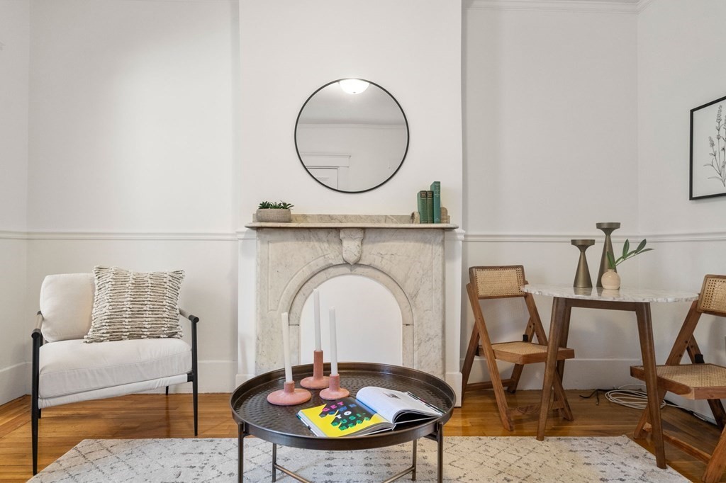 110 Elm Street, Unit 1 Boston, MA 02129 - Photo 4 of 17 a living room with furniture and a mirror