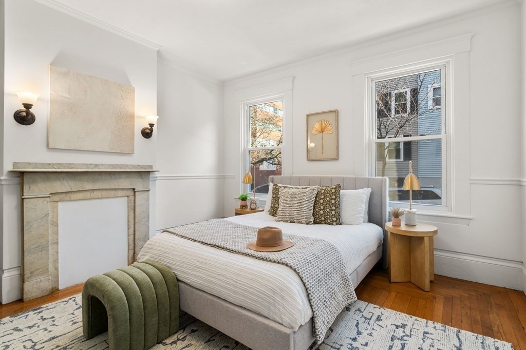 110 Elm Street, Unit 1 Boston, MA 02129 - Photo 8 of 17 a bedroom with a bed and a lamp