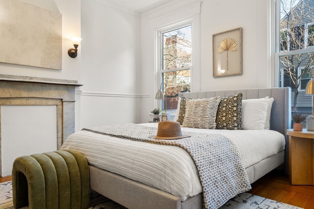 110 Elm Street, Unit 1 Boston, MA 02129 - Photo 9 of 17 a bedroom with a bed and window