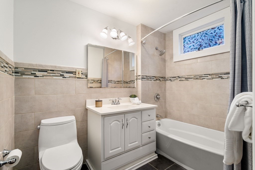110 Elm Street, Unit 1 Boston, MA 02129 - Photo 10 of 17 a bathroom with a toilet sink and shower