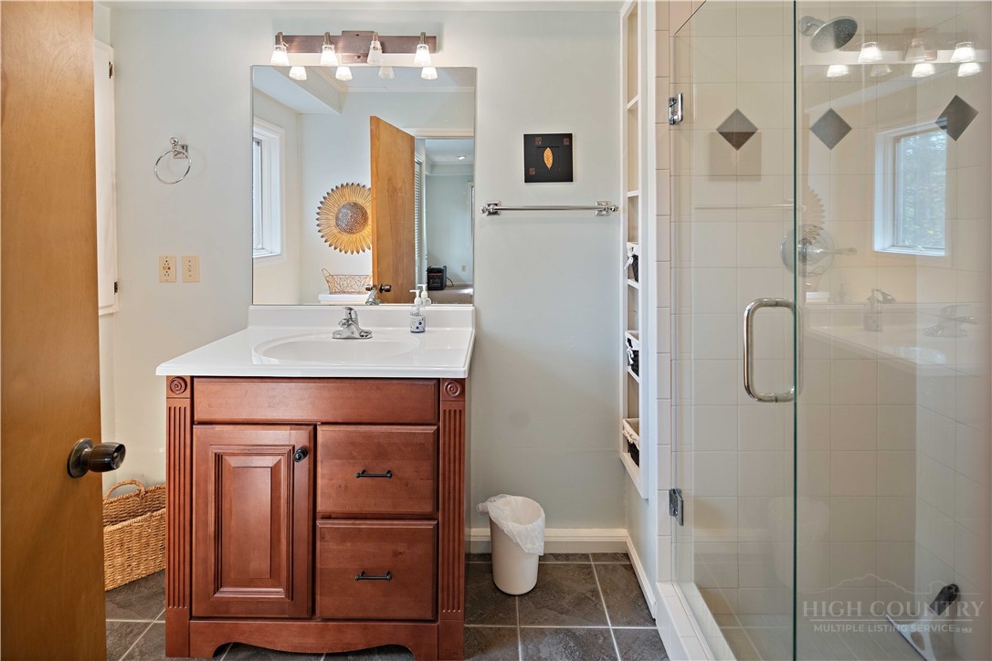 265 Leatherwood Road Banner Elk, NC 28604 - Photo 32 of 42 a bathroom with a sink a toilet and shower