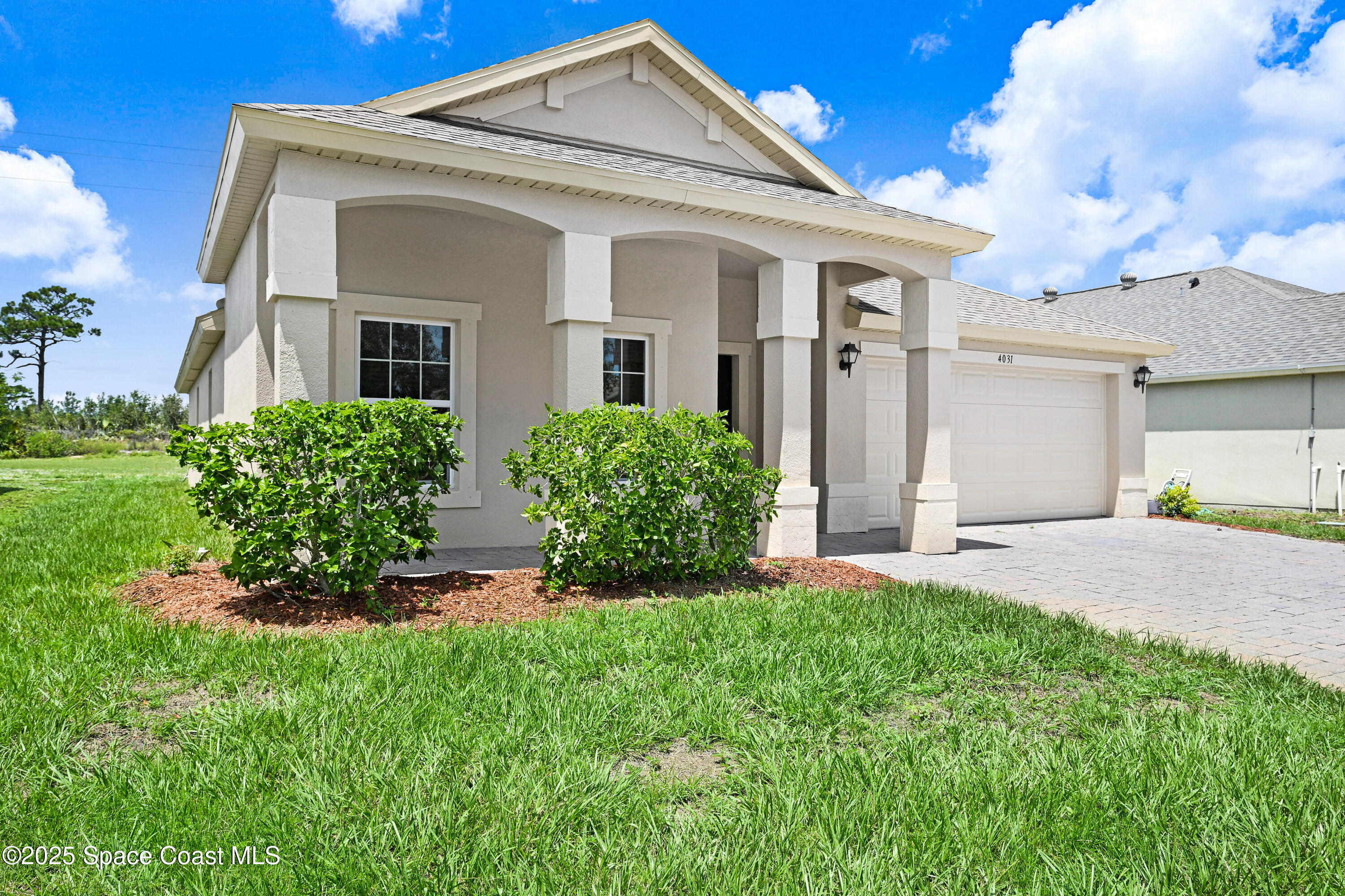 4031 Brantley Circle Rockledge, FL 32955 - Photo 2 of 41 a front view of a house with a yard