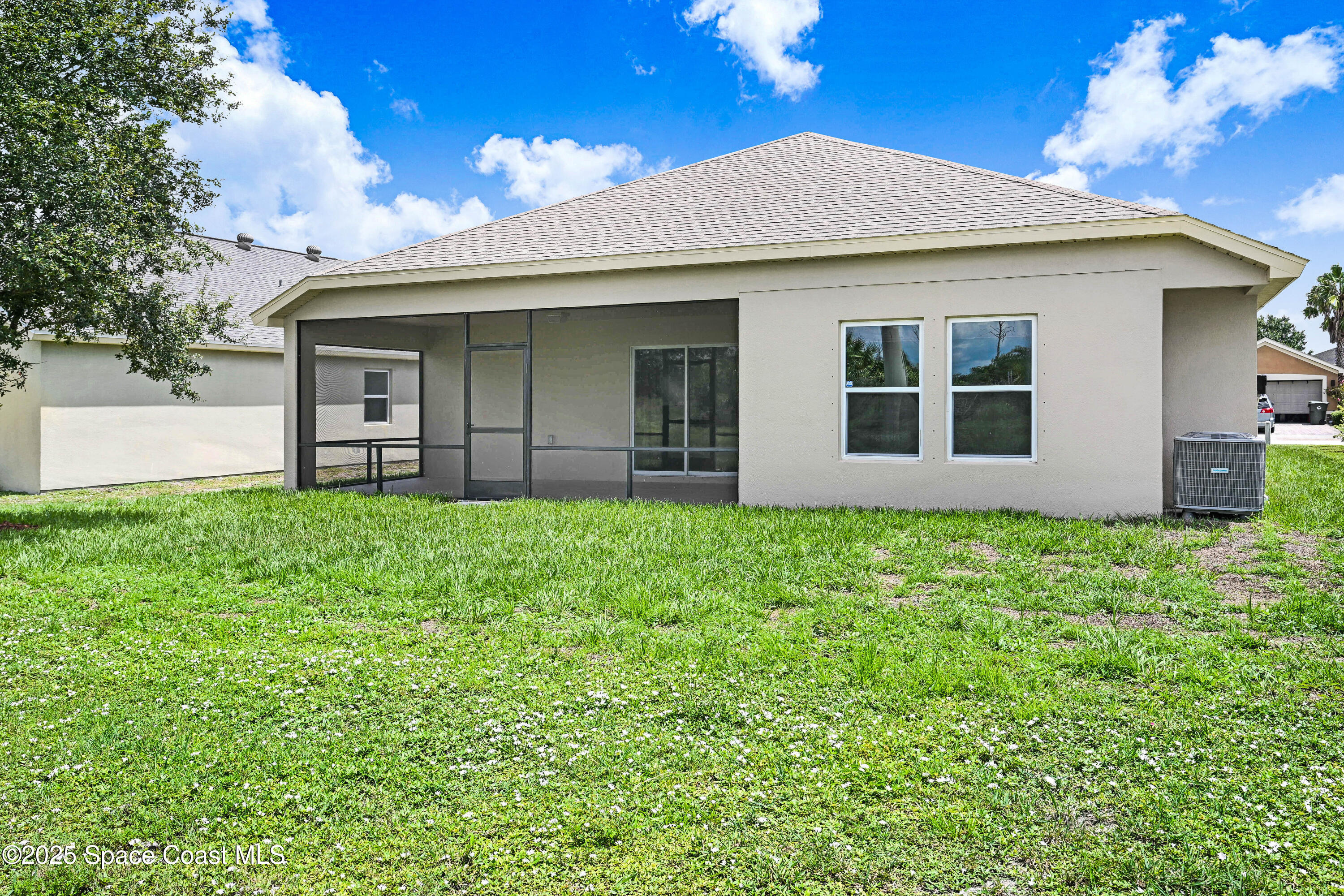 4031 Brantley Circle Rockledge, FL 32955 - Photo 23 of 41 a view of a house with garden