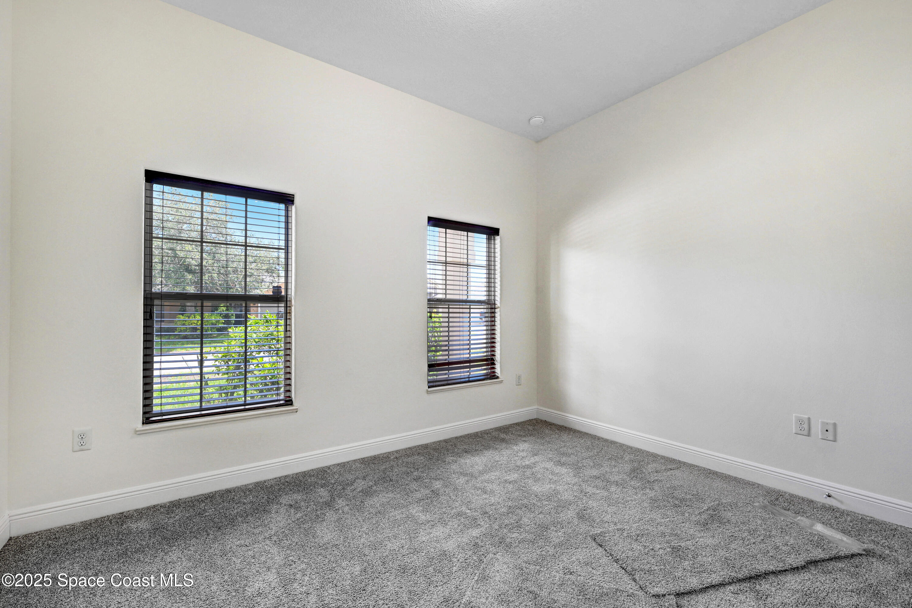 4031 Brantley Circle Rockledge, FL 32955 - Photo 28 of 41 an empty room with windows
