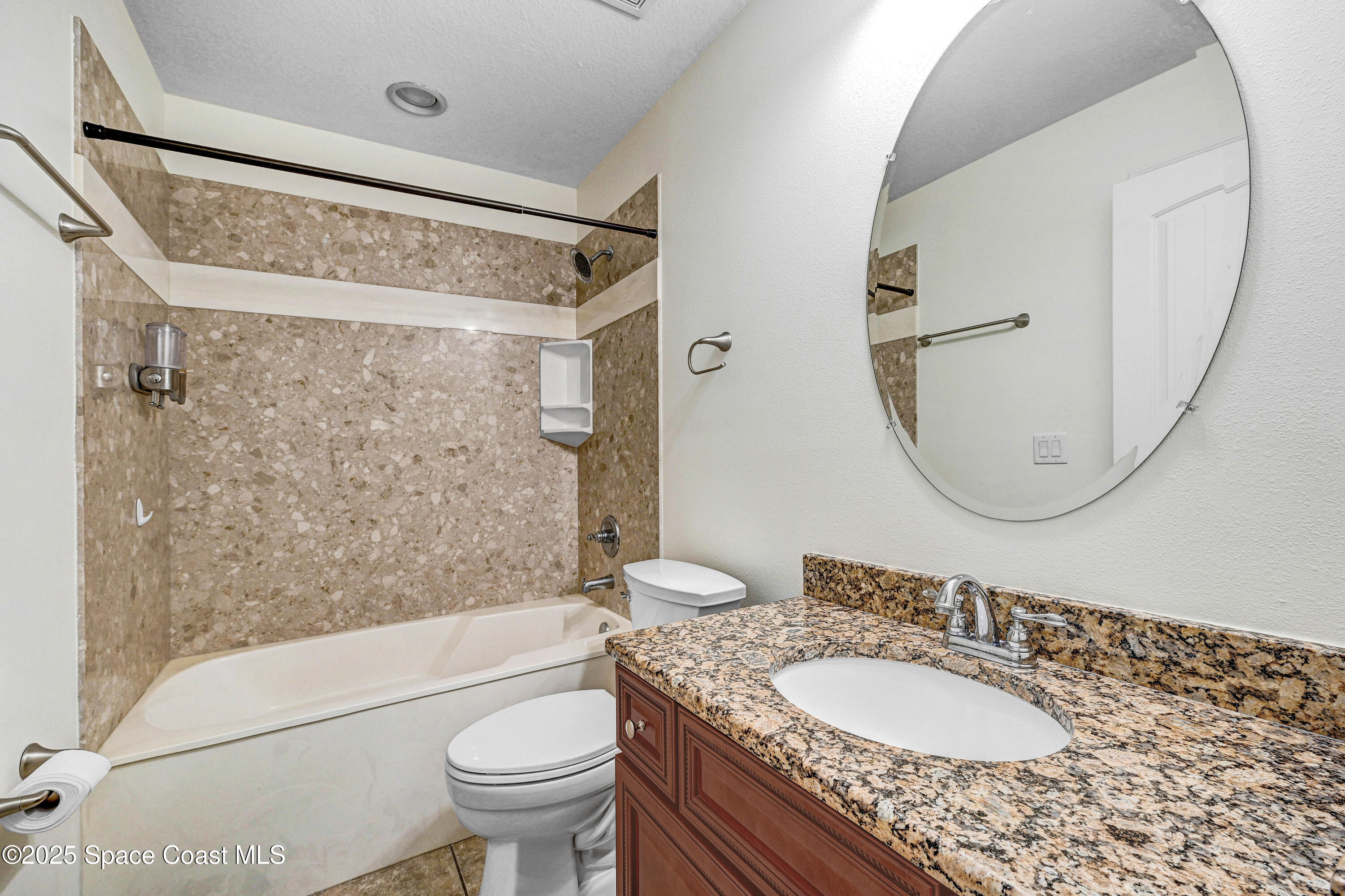 4031 Brantley Circle Rockledge, FL 32955 - Photo 30 of 41 a bathroom with a granite countertop sink toilet a mirror and shower