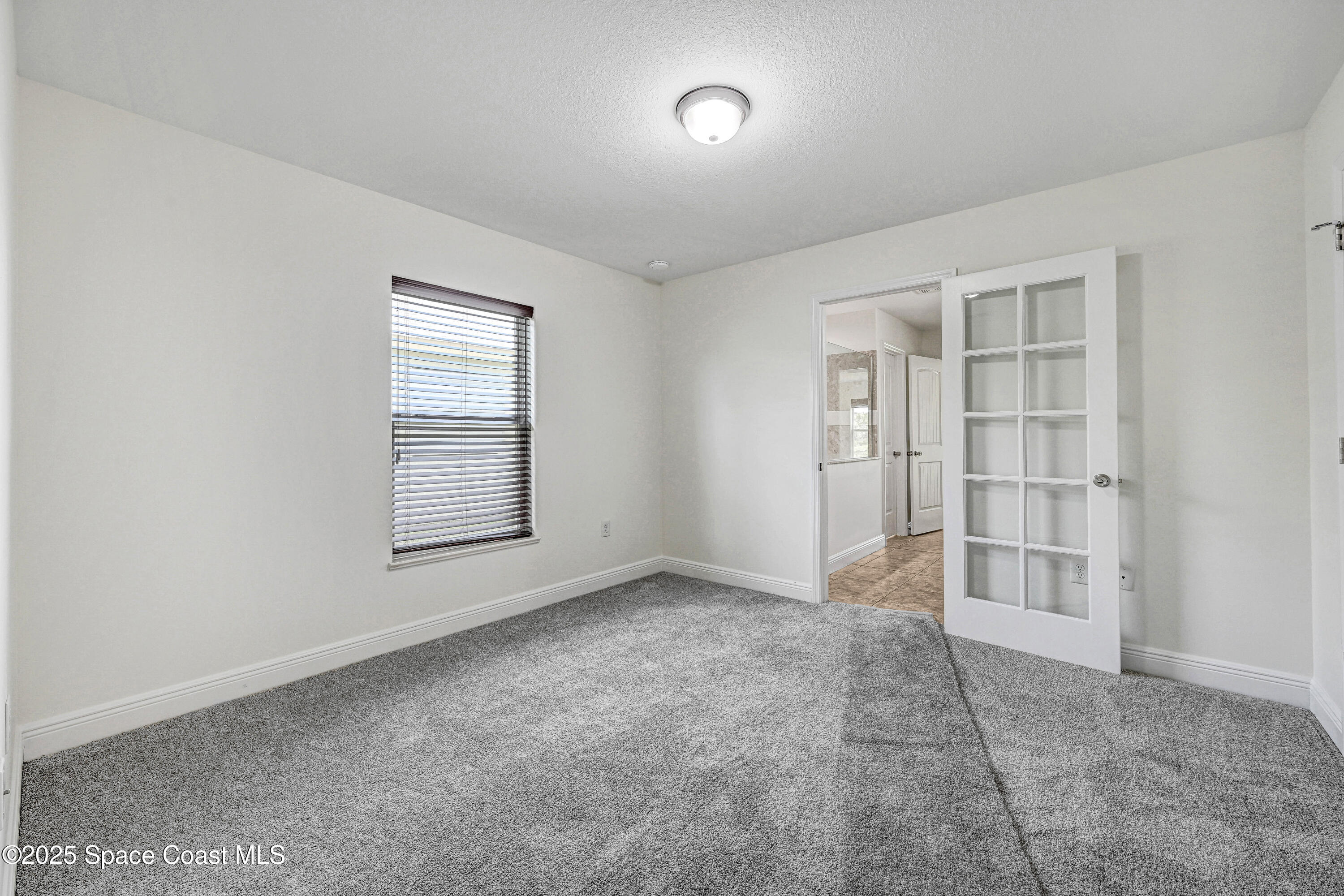 4031 Brantley Circle Rockledge, FL 32955 - Photo 41 of 41 an empty room with windows