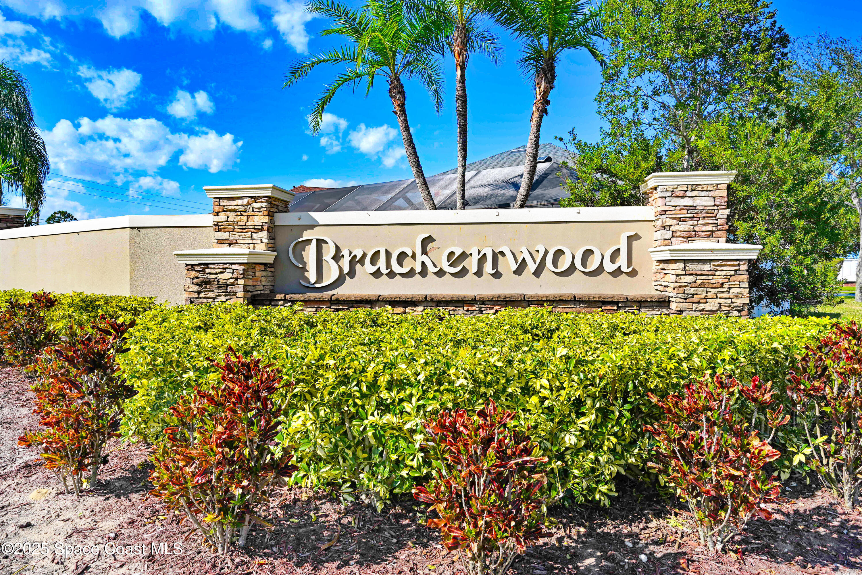 4031 Brantley Circle Rockledge, FL 32955 - Photo 5 of 41 a sign that is sitting in front of flowers