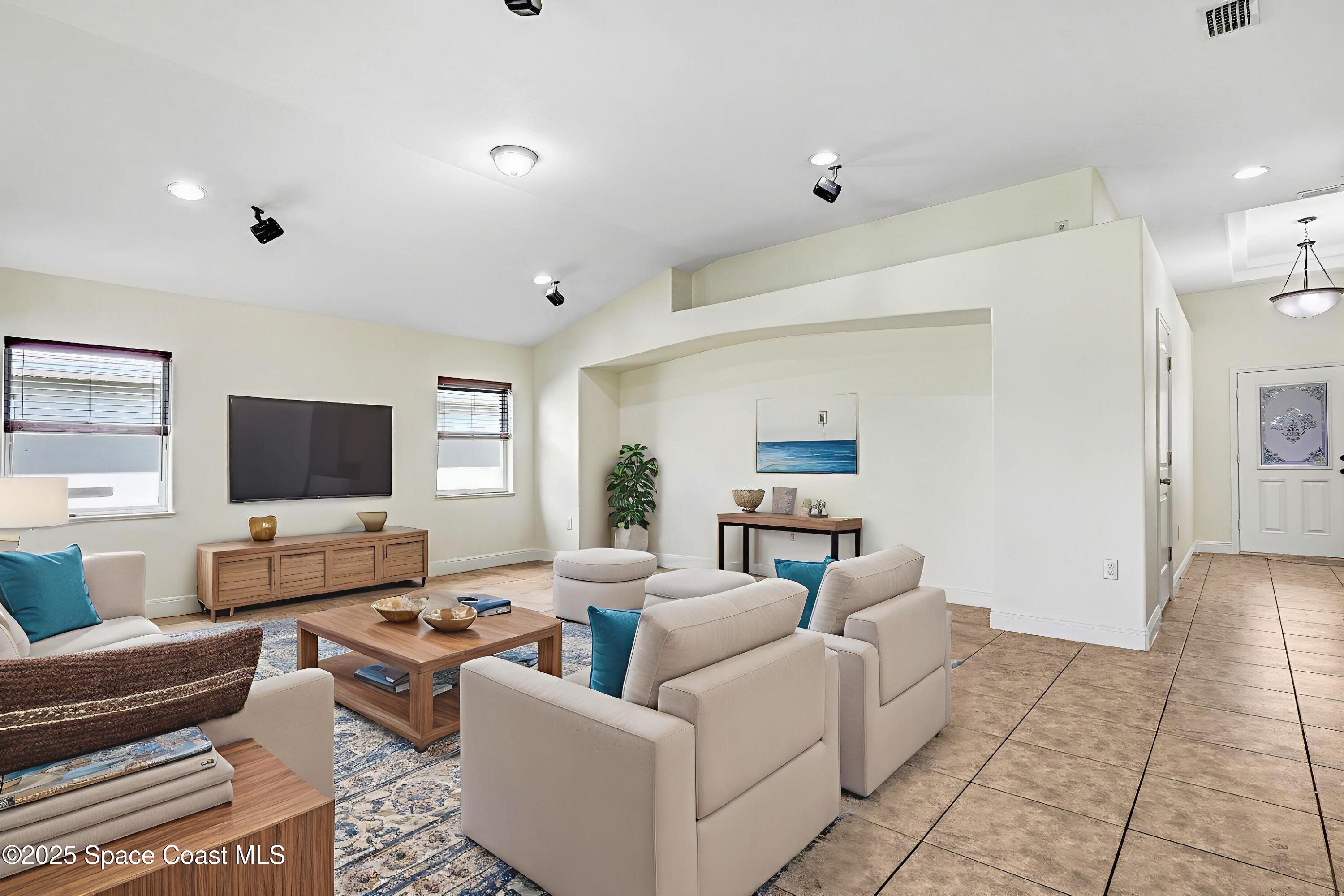 4031 Brantley Circle Rockledge, FL 32955 - Photo 8 of 41 a living room with furniture and a flat screen tv