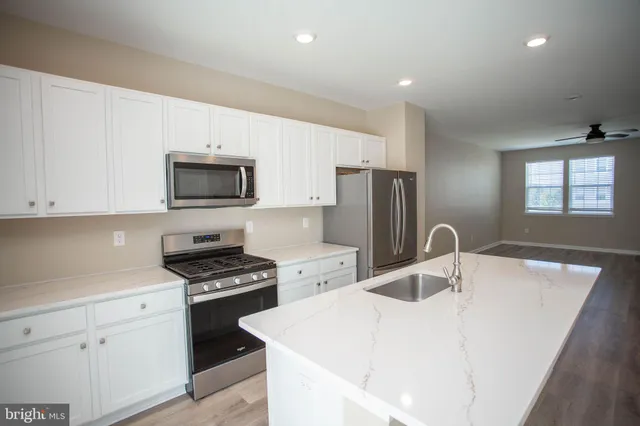 a white toilet sitting next to a window