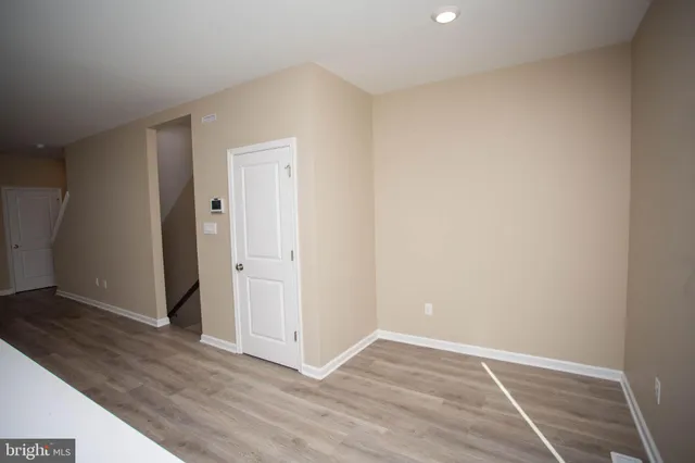 an empty room with a potted plant