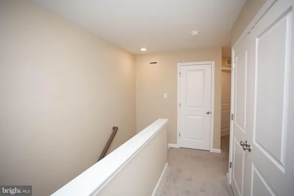 a bathroom with a shower and a sink