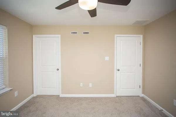a bathroom with a bathtub and a toilet