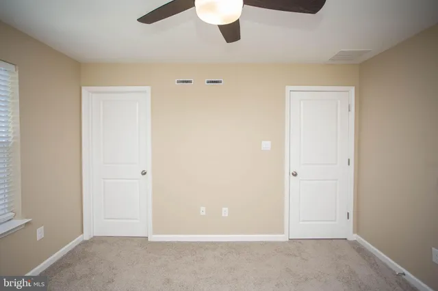 a bathroom with a bathtub and a toilet