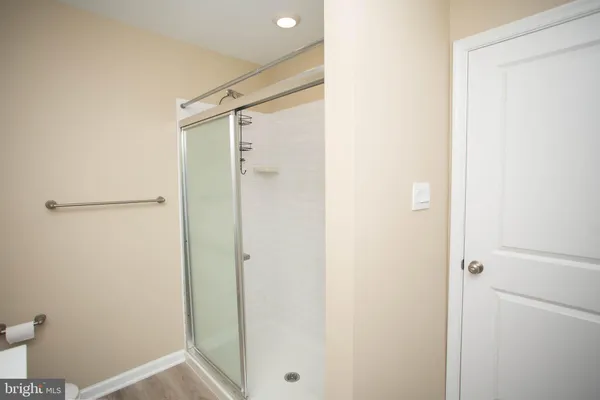an empty room with window and wooden floor