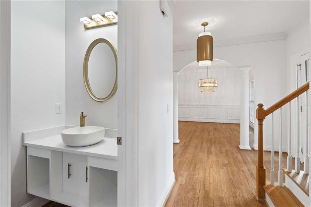 1711 Summit Glen Lane Northeast Atlanta, GA 30329 - Photo 13 of 42 a bathroom with a sink and a mirror