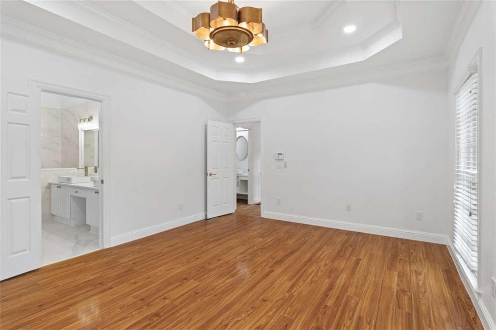 1711 Summit Glen Lane Northeast Atlanta, GA 30329 - Photo 14 of 42 wooden floor in an empty room with a window