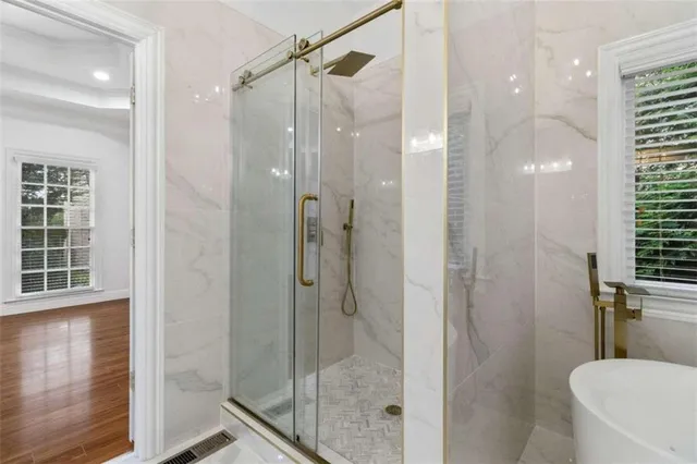 a bathroom with a shower and toilet