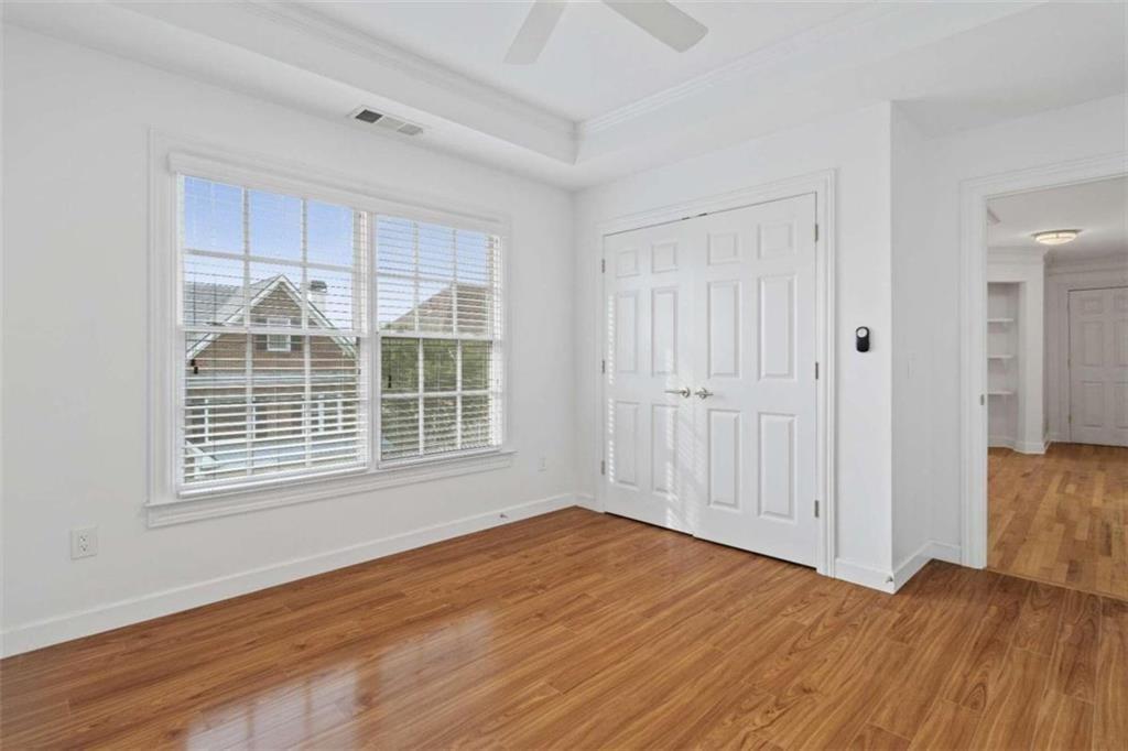 1711 Summit Glen Lane Northeast Atlanta, GA 30329 - Photo 26 of 42 a view of an empty room with wooden floor and a window