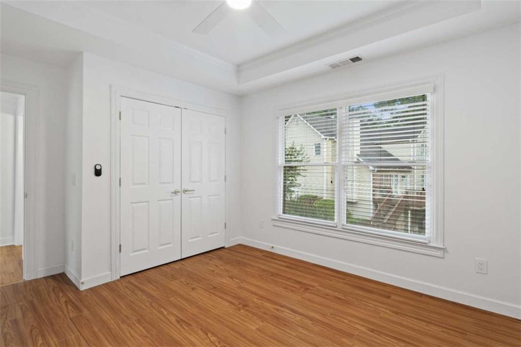 1711 Summit Glen Lane Northeast Atlanta, GA 30329 - Photo 28 of 42 a view of an empty room with wooden floor and a window