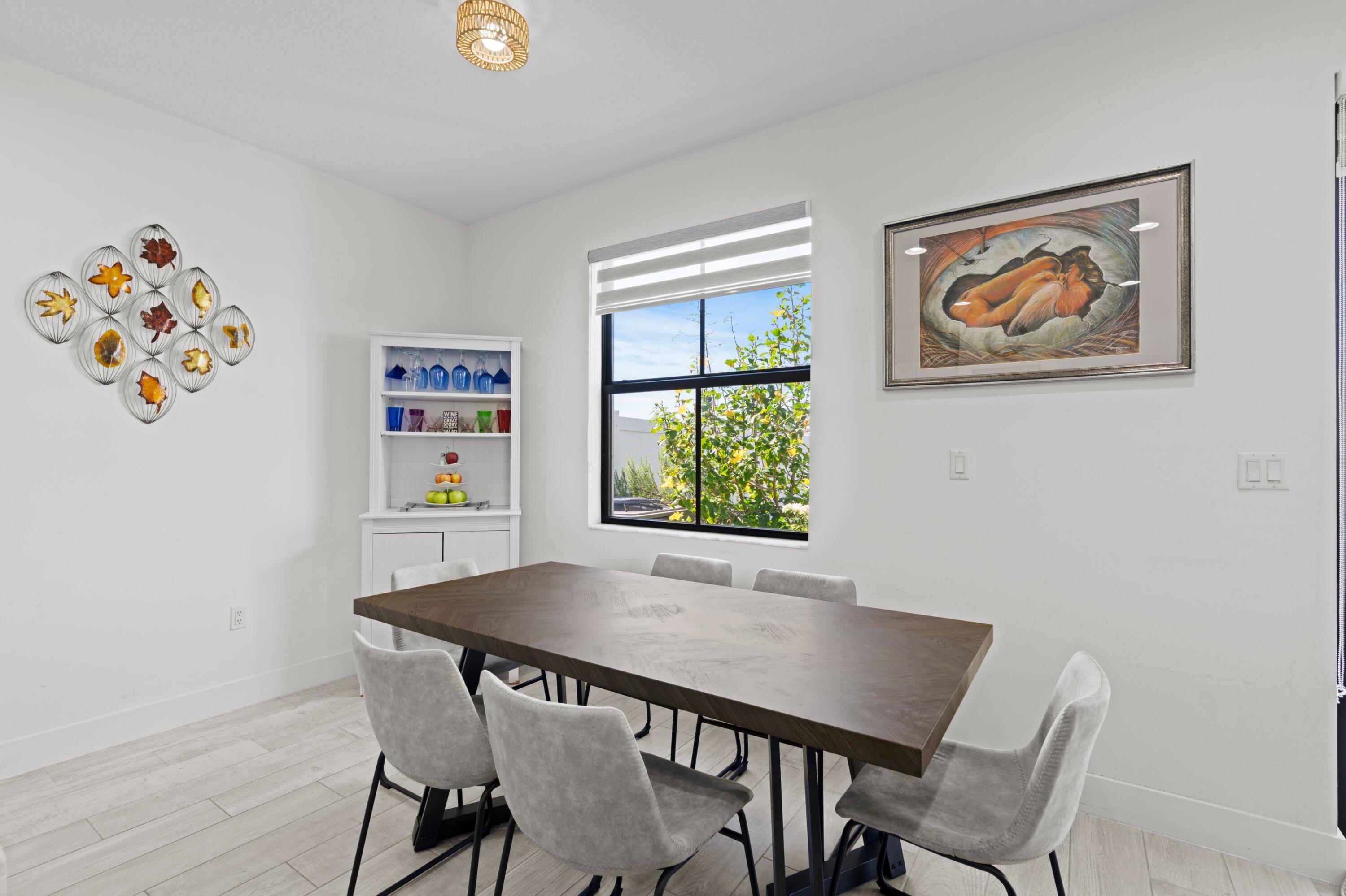 4021 Sycamore Cove Riviera Beach, FL 33410 - Photo 15 of 37 a view of a dining room with furniture