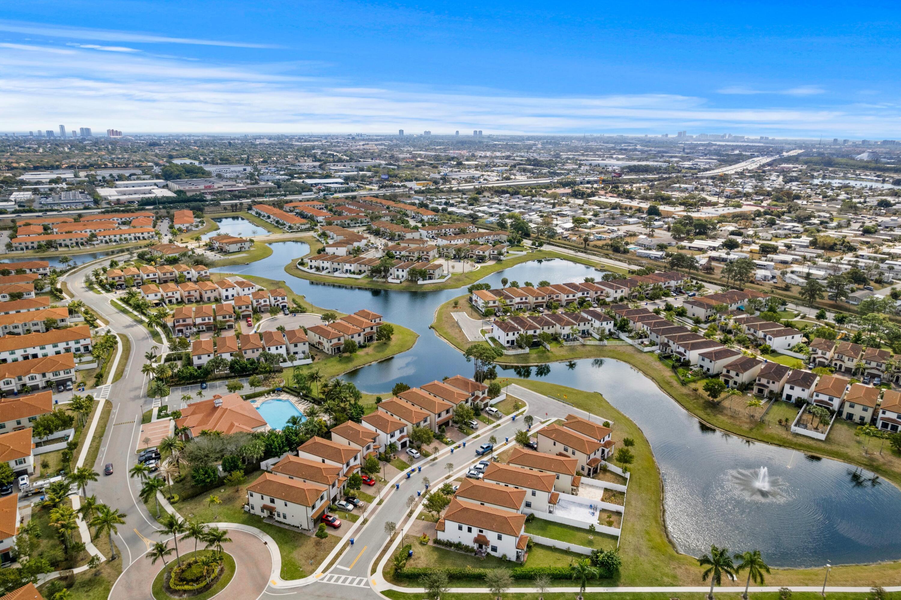 4021 Sycamore Cove Riviera Beach, FL 33410 - Photo 31 of 37 an aerial view of city and lake