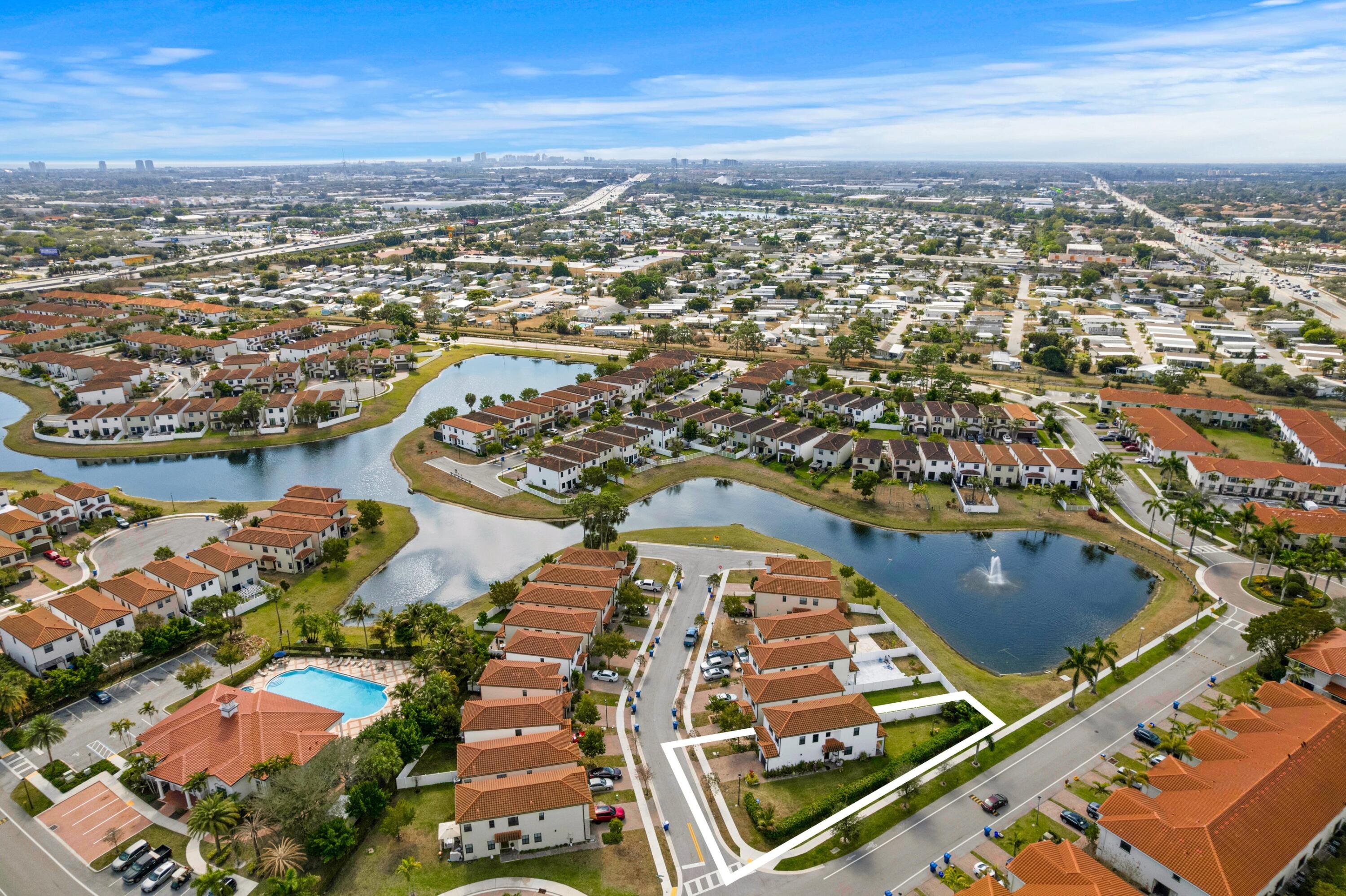 4021 Sycamore Cove Riviera Beach, FL 33410 - Photo 32 of 37 an aerial view of residential houses with outdoor space