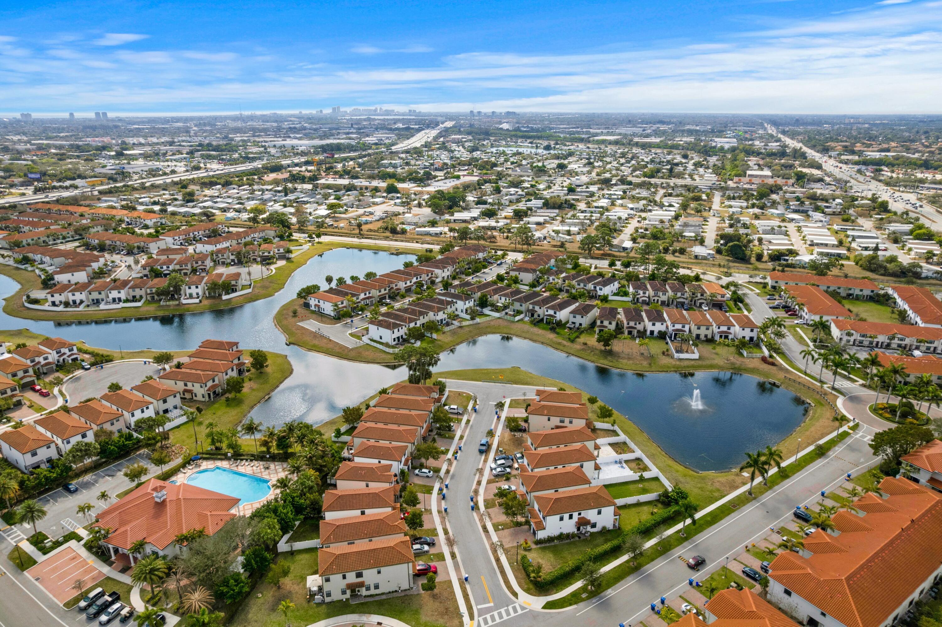 4021 Sycamore Cove Riviera Beach, FL 33410 - Photo 33 of 37 an aerial view of residential houses with outdoor space
