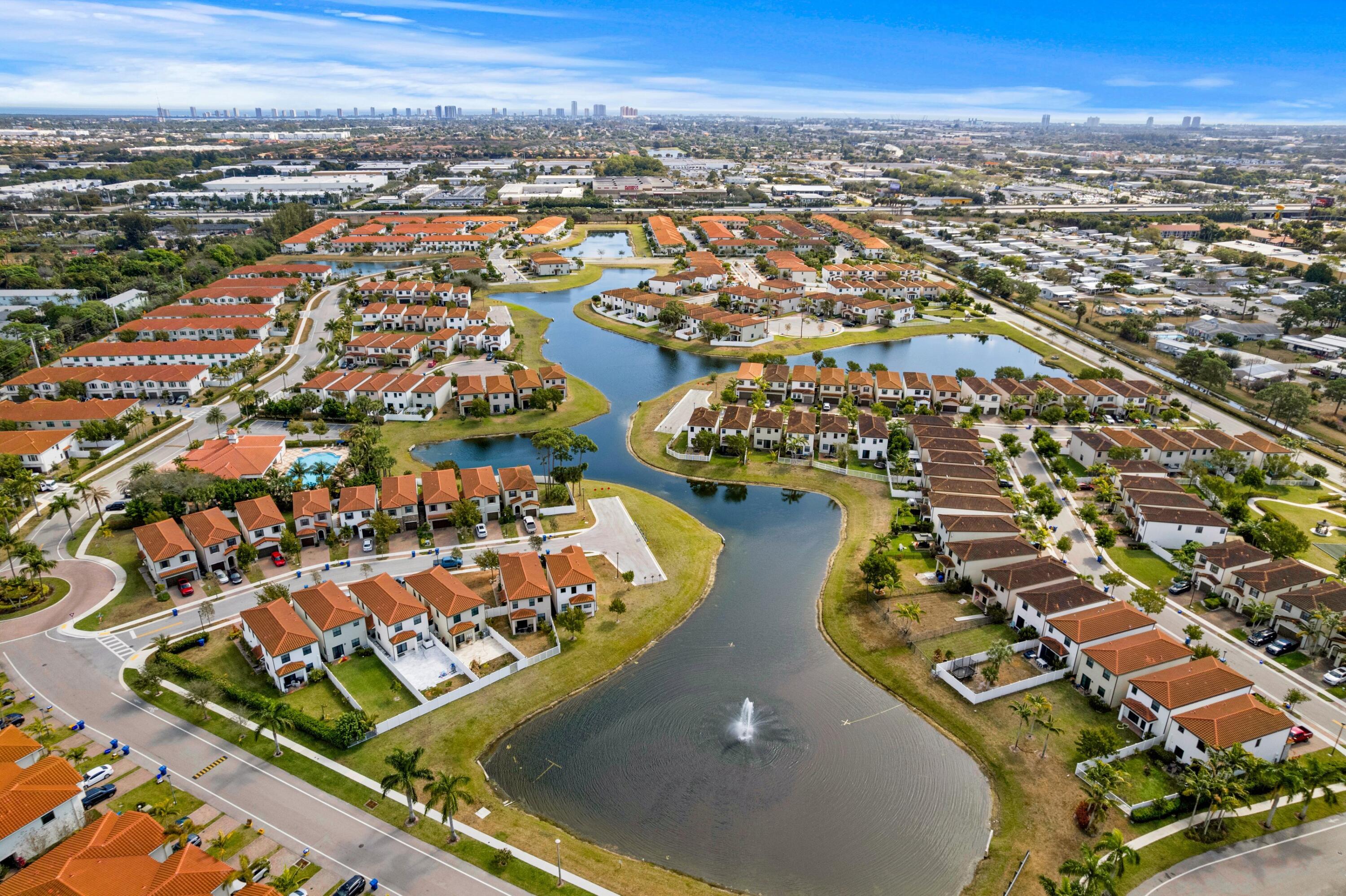 4021 Sycamore Cove Riviera Beach, FL 33410 - Photo 34 of 37 an aerial view of residential houses with outdoor space