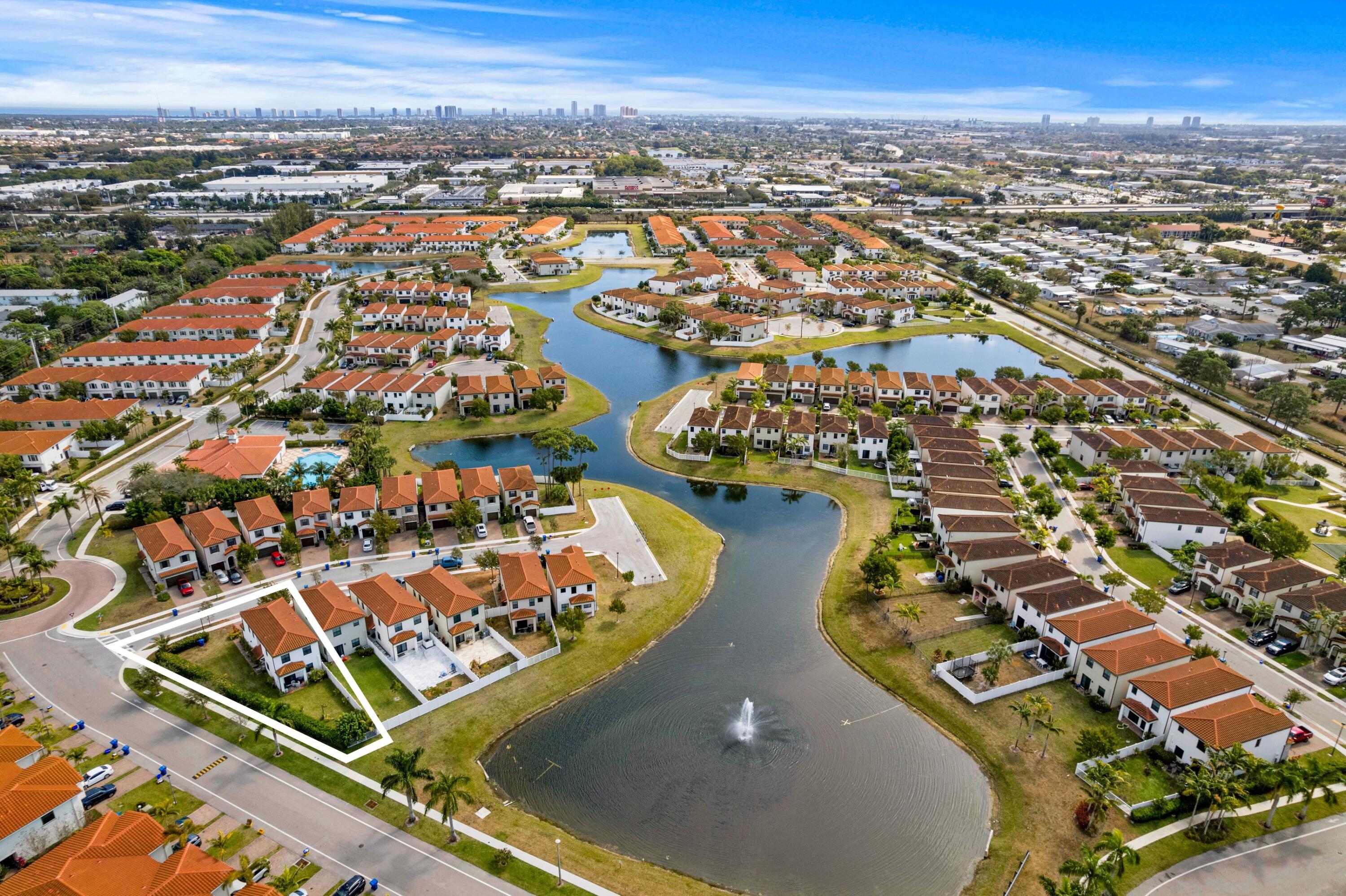 4021 Sycamore Cove Riviera Beach, FL 33410 - Photo 35 of 37 an aerial view of residential houses with outdoor space
