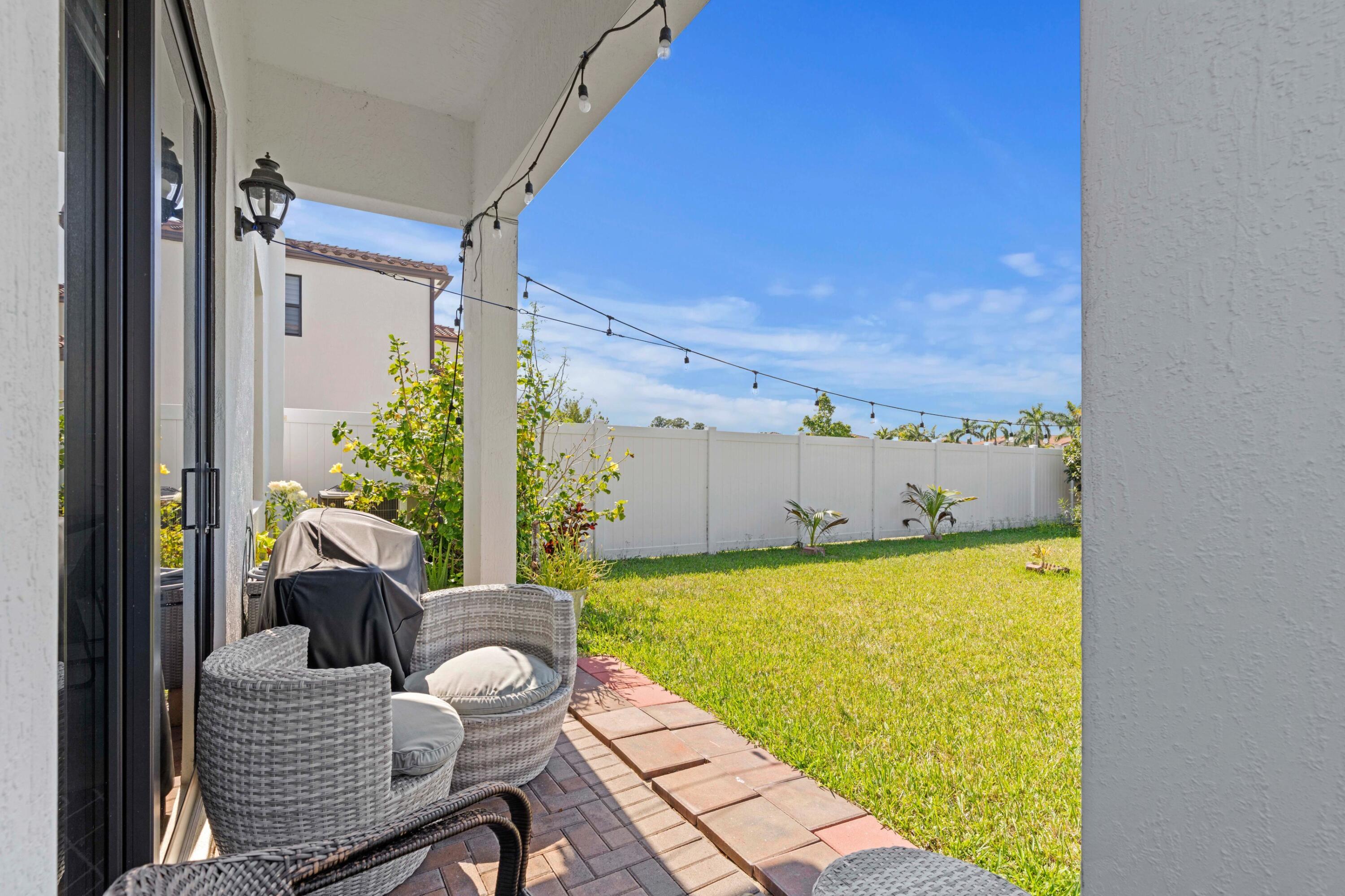 4021 Sycamore Cove Riviera Beach, FL 33410 - Photo 5 of 37 a view of a balcony with chairs