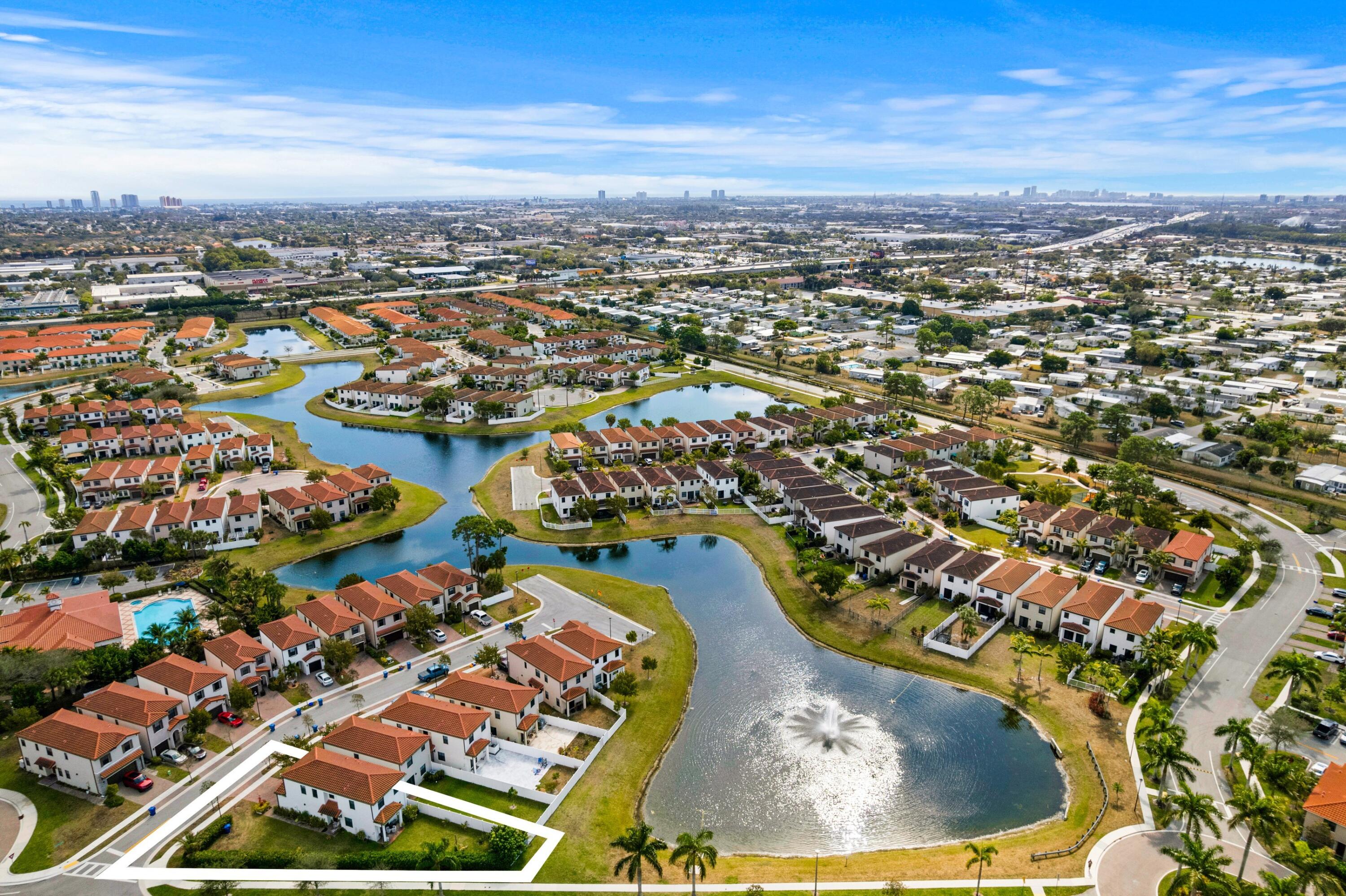 4021 Sycamore Cove Riviera Beach, FL 33410 - Photo 8 of 37 an aerial view of residential houses with outdoor space