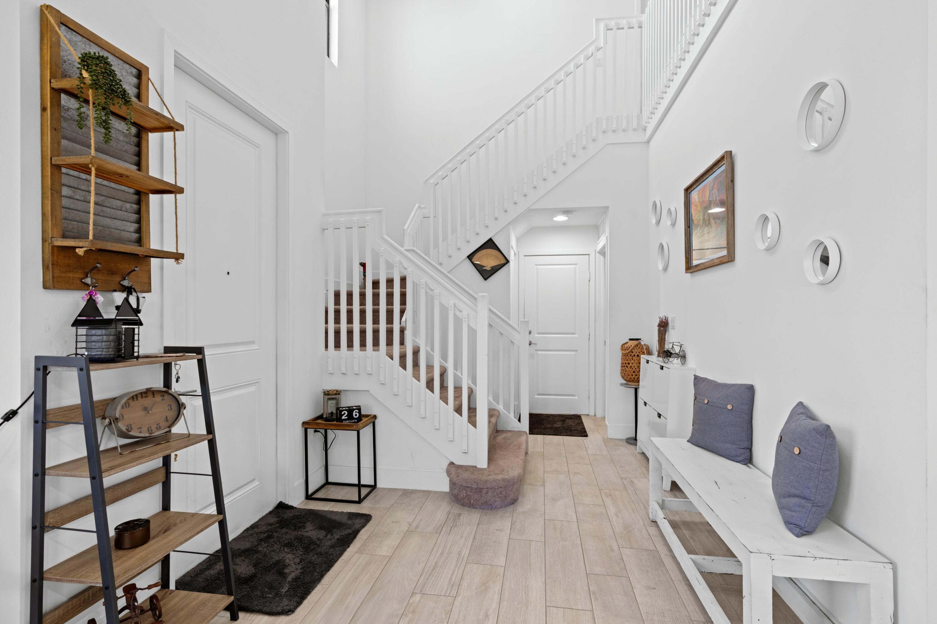 4021 Sycamore Cove Riviera Beach, FL 33410 - Photo 10 of 37 a view of entryway and hall with wooden floor